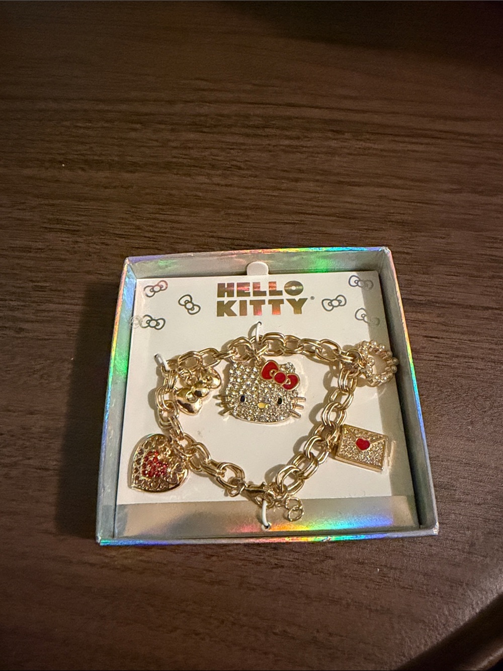 Hello Kitty Gold-Tone Charm Bracelet with Red Accents
